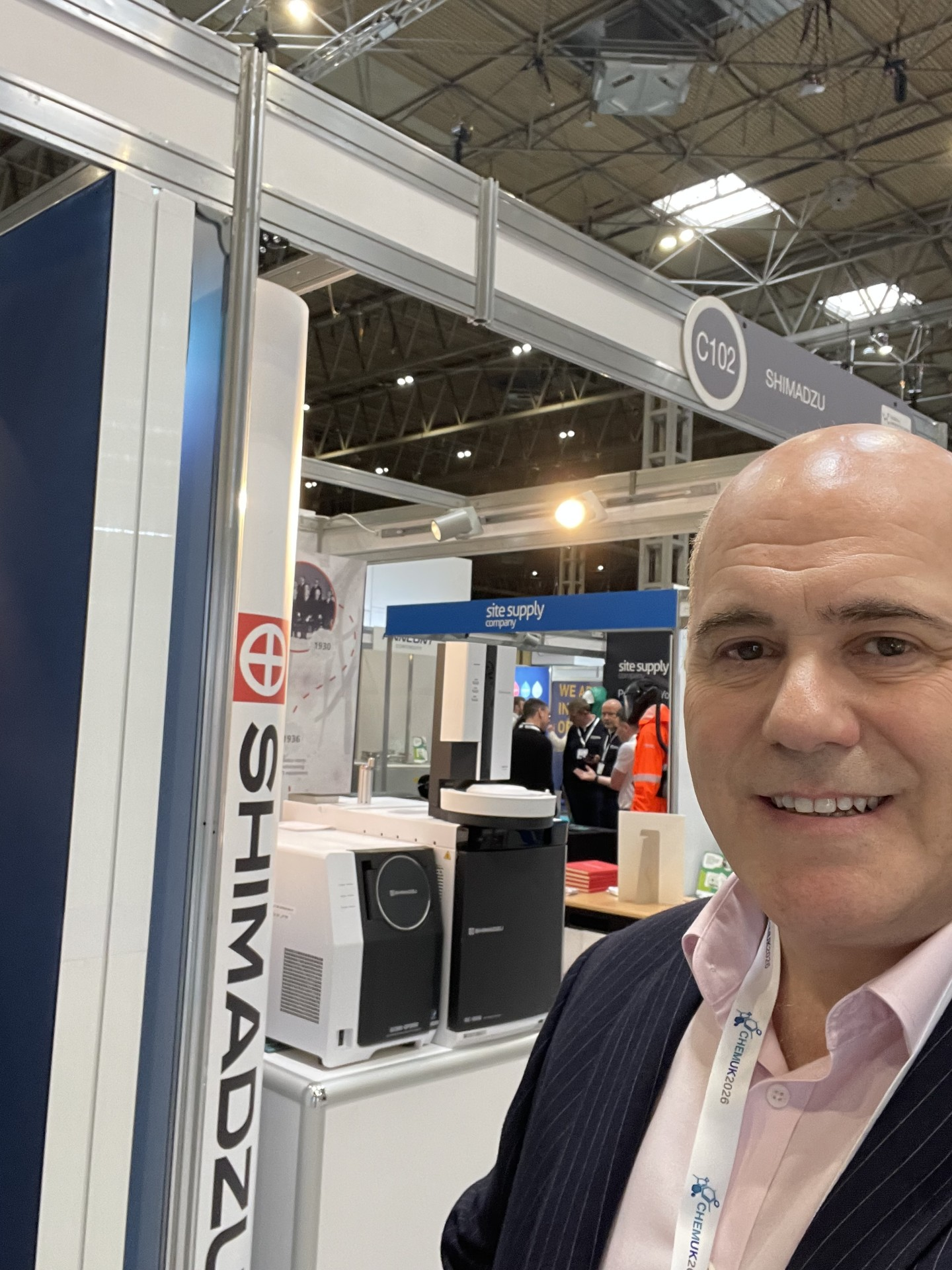 Richard Solomon at the Shimadzu exhibition stand with scientific instrumentation